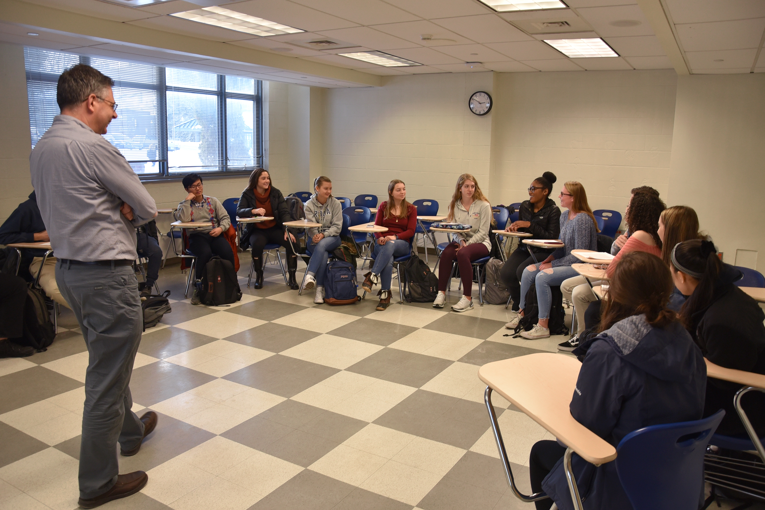 professor in classroom with students in Department of Pathobiology at UConn